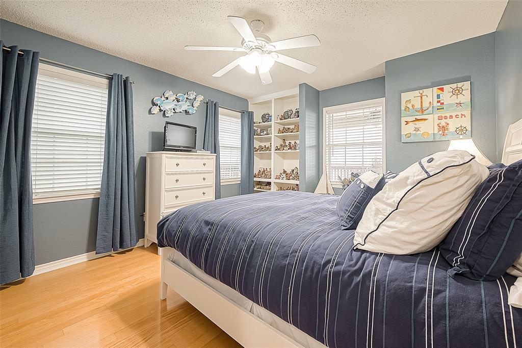 Another guest bedroom, this one looks out the porch and the bay.