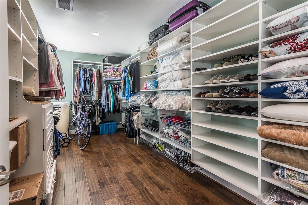 There are TWO of these giant storage closets that were part of 2011/2012 addition. (Are you jealous?) This one is fitted with adjustable built-in shelving on both sides!  The other closet, next to it, is without shelving, for you to choose how to use it. They are approx 20x8 and 17x8.