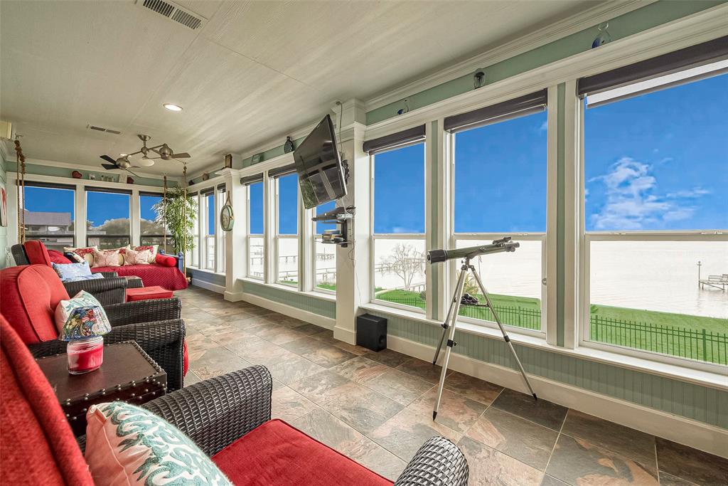 Step into this wonderful 40-ft long sunroom overlooking the bay!  All the comforts are here, including a/c, fans and solar screens.