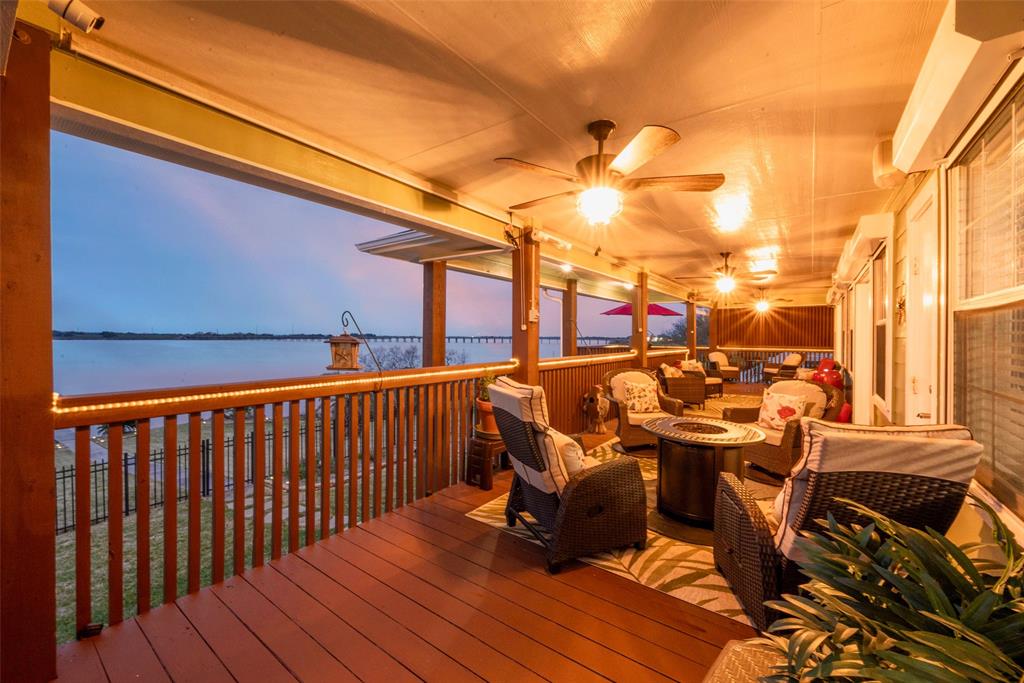 This upper porch is 40 feet of easy living and sunset views!