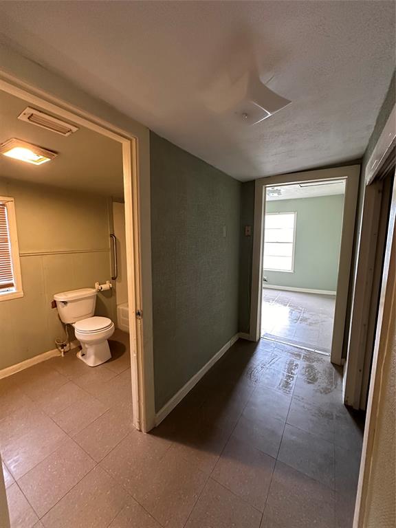 Hallway leading to the other two bedrooms