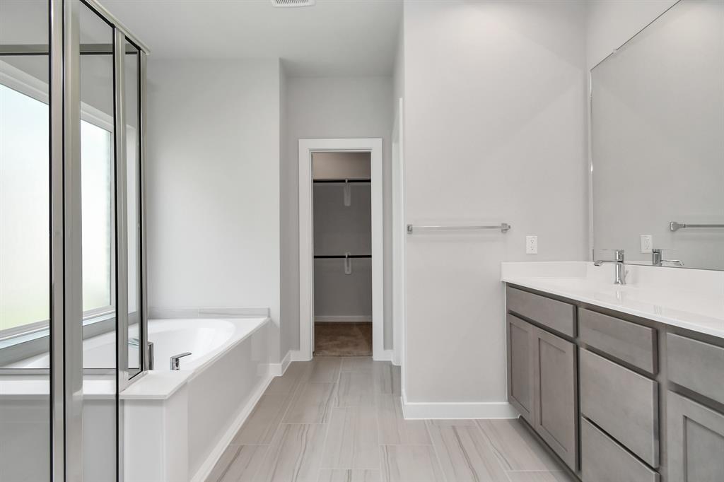 Experience a spa-like escape right in the heart of your primary bathroom.