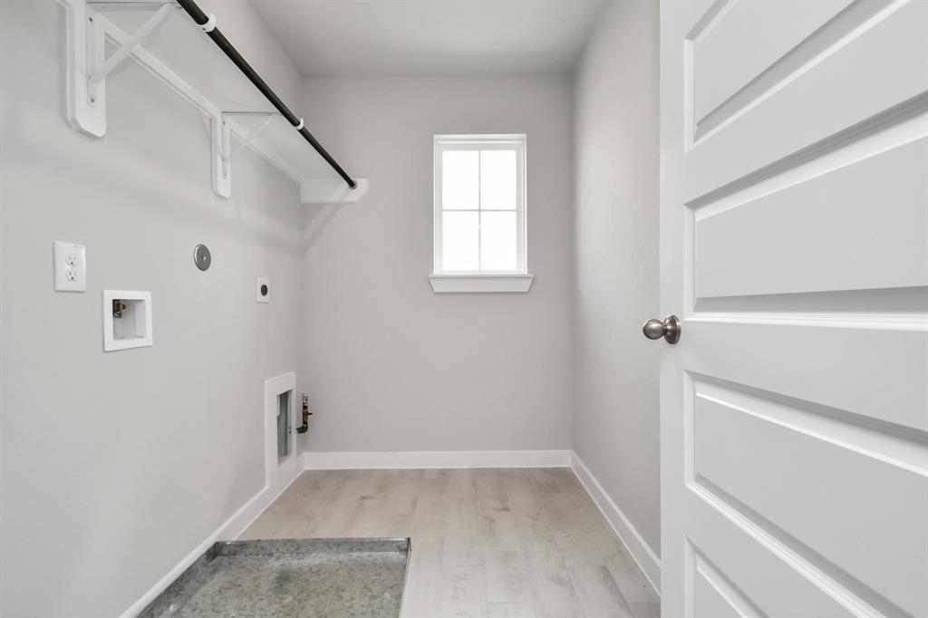 In house utility room with both electric and gas dryer connections