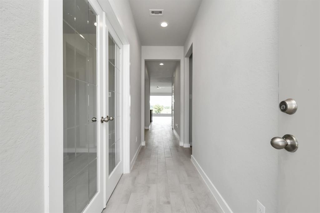 As you step into the threshold of this luxurious home, you\'ll soon be welcomed by an elegant glass door (to be isntalled). Inside, soaring ceilings amplify the spaciousness, while the refined wood-look tile flooring and oversized baseboards exude sophistication and charm.