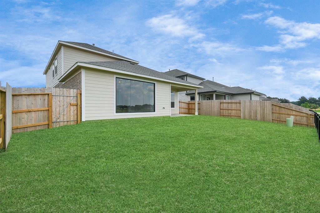 Explore the expansive backyard with its inviting covered patio—a perfect blend of space for the kids to play and adults to unwind. Ideal for creating your outdoor oasis, this backyard accommodates patio furniture, a BBQ pit, and endless possibilities for leisure and entertainment.