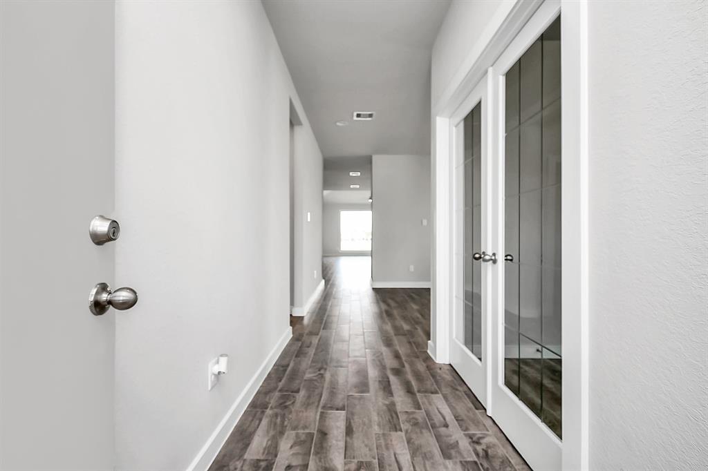 As you step into the threshold of this luxurious home, you\'ll soon be welcomed by an elegant glass door (to be isntalled). Inside, soaring ceilings amplify the spaciousness, while the refined wood-look tile flooring and oversized baseboards exude sophistication and charm.