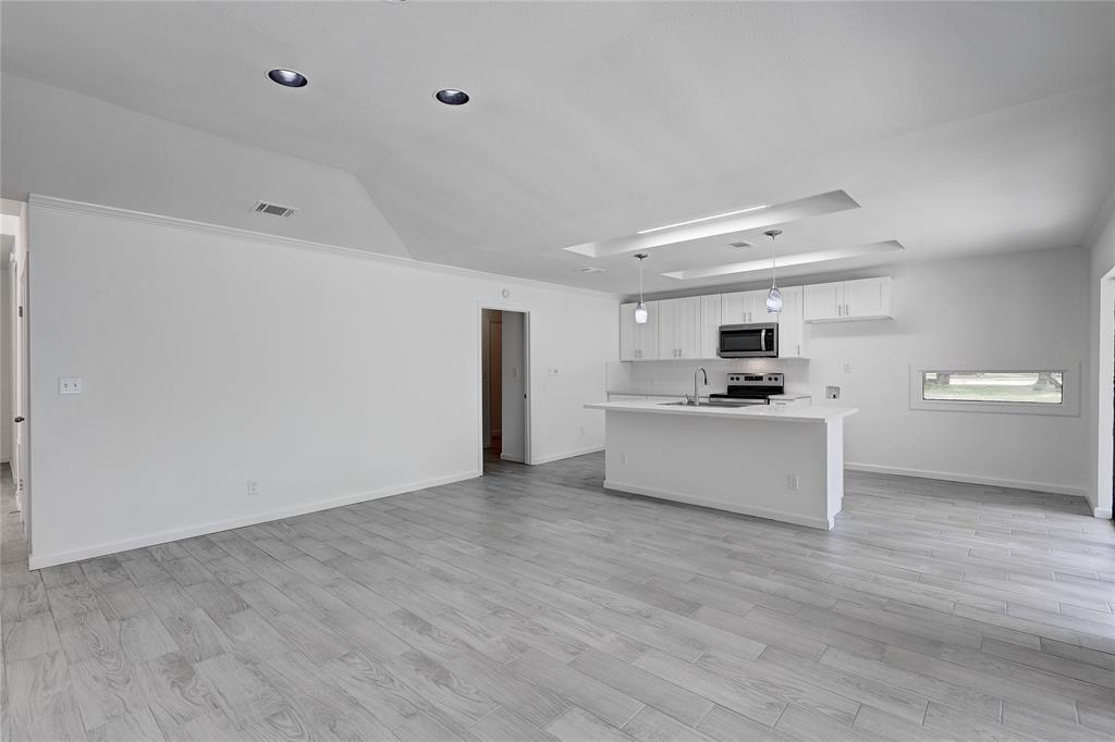 Kitchen looking into pantry-storage area