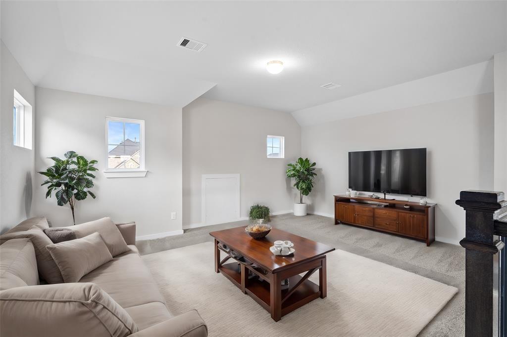 Come upstairs and enjoy a day of leisure in this fabulous loft/game room! This is the perfect hangout spot or adult game room, this space features plush carpet, high ceiling, recessed lighting and custom paint.