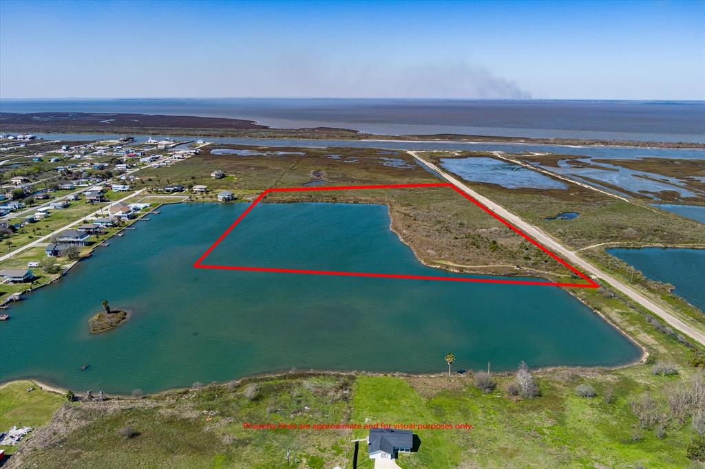 This 21-acre parcel of land located Bayside in the heart of Crystal Beach offers approximately 11 acres for potential development or personal use. The property boasts great privacy and opportunities for fishing and crabbing, with approximately 1400 feet of Lake frontage. The remaining acreage features a Lake and other natural features, making it a versatile and picturesque piece of land with terrific sunsets. There is a recently completed survey and environmental phase 1 study available for serious inquiries. Don't miss this opportunity to own your own slice of paradise! Located in a FEMA Zone.
