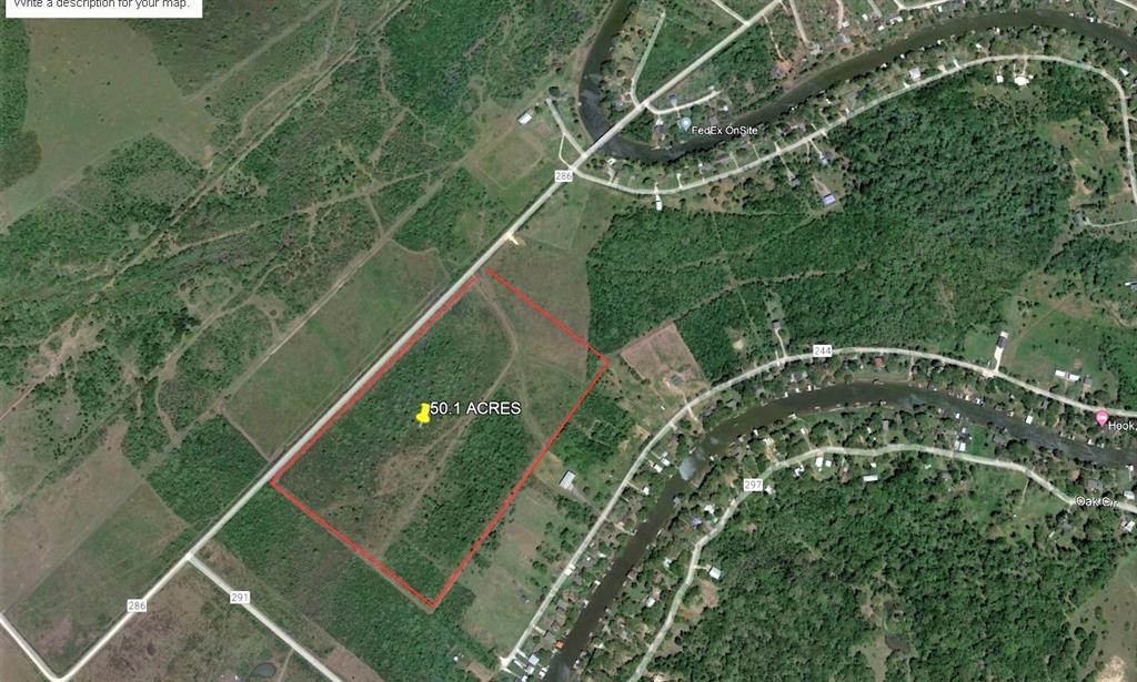 50.1 Acres between two very nice subdivisions, priced to sell.  Unrestricted acreage, fenced on 3 sides, two gates, one very nice driveway, good drainage, partially wooded.  Just waiting for your ideas for residence or business.
