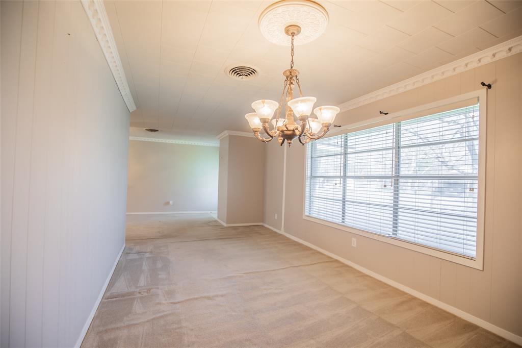 Oversized dining room offers a little length for a couple of cozy chairs or a wall piano.