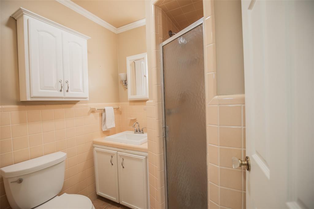 Shower, updated toilet, and NOTICE the glass door knobs throughout the home - unique and in stellar condition. The care and condition of this home is hard to find.