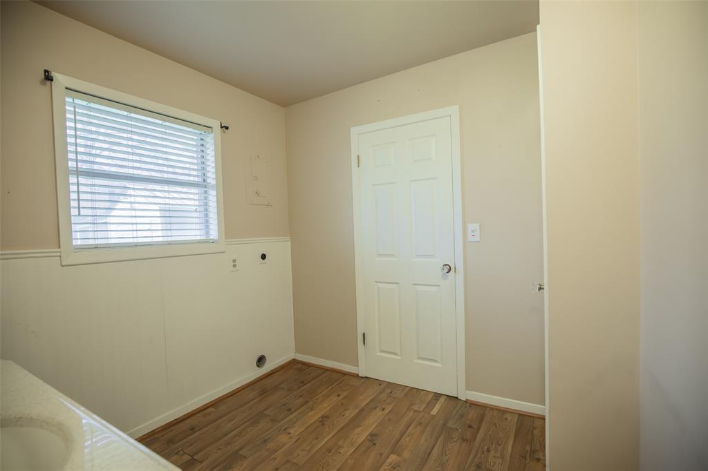 Large laundry room with the storage closet to the back