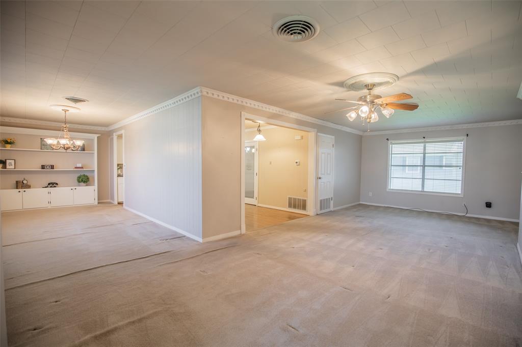 The formal dining sits to the left, the family room is to the back and flows easily between both rooms.