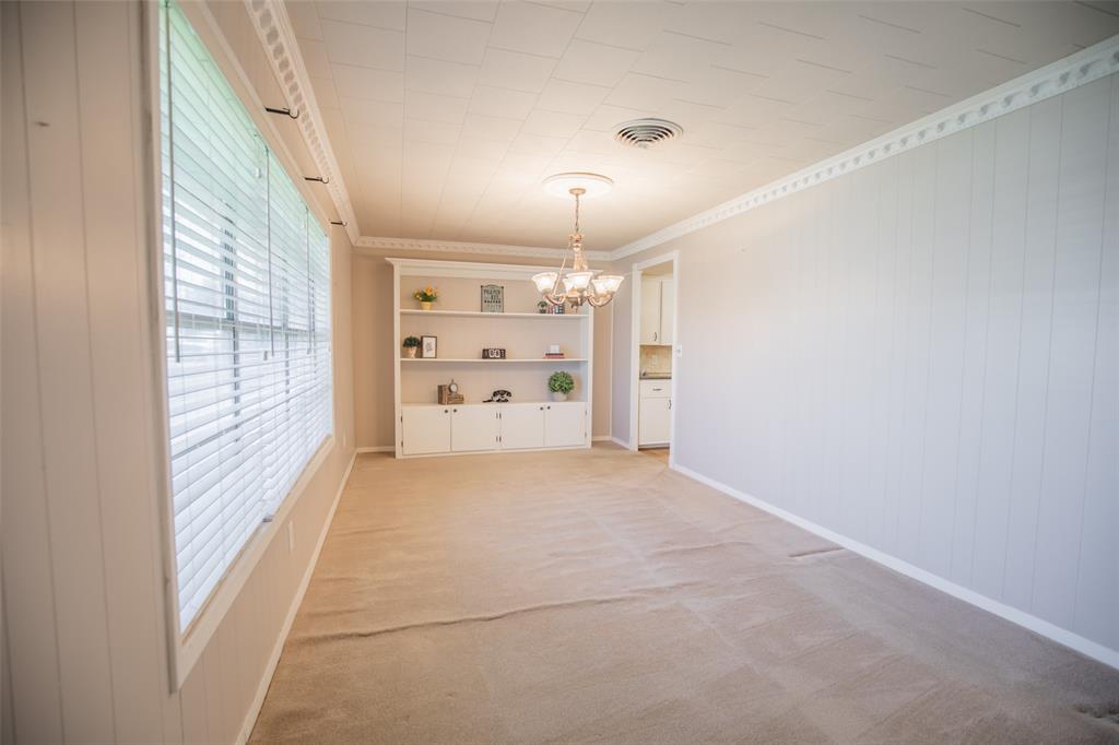 Oversized dining room over looks the front lawn and offers options... dining, home office, play room.