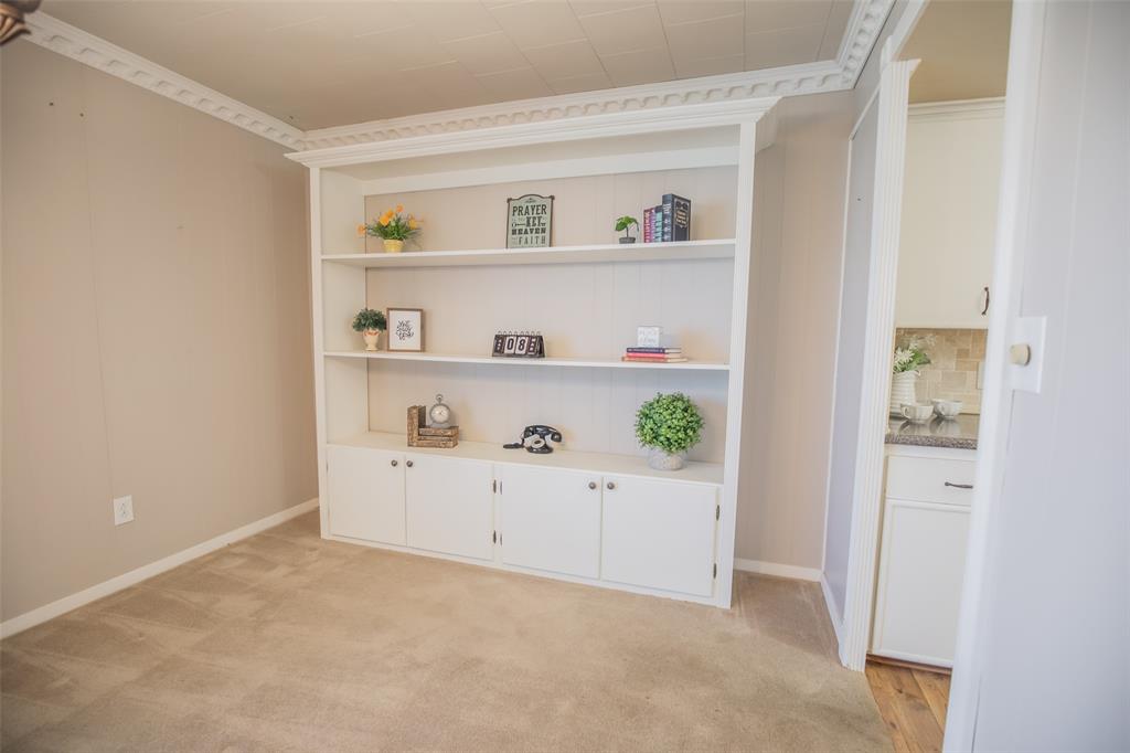 Display your treasures, books, fine china. The connection between this room and the kitchen offers ease in  serving supper.