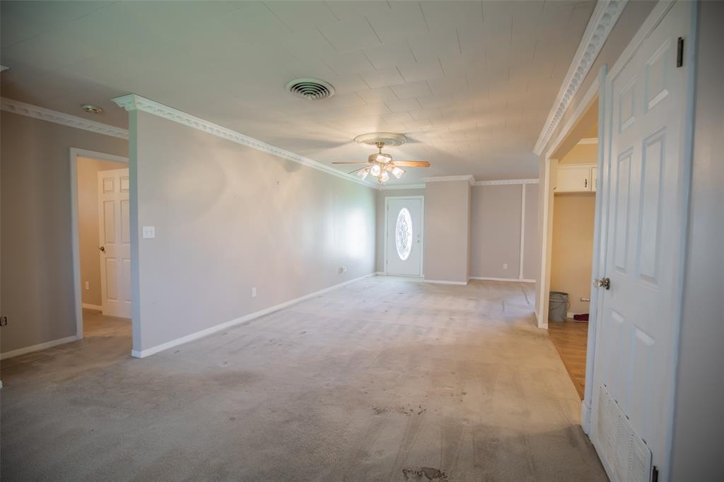 Hallway to the left accesses 2 bedrooms and a bathroom.