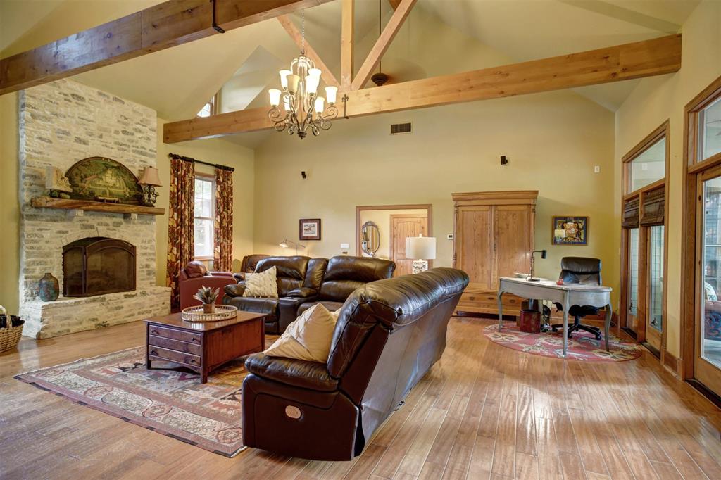 Living space has custom built in book case and gas fireplace feature