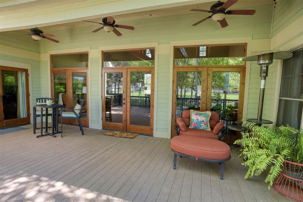 Primary suite in the custom wing on the main floor with access to back deck