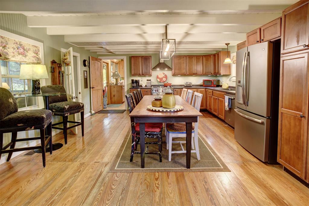 Beamed ceilings custom cabinetry and upgraded stainless appliances are just some of the great features of this kitchen.