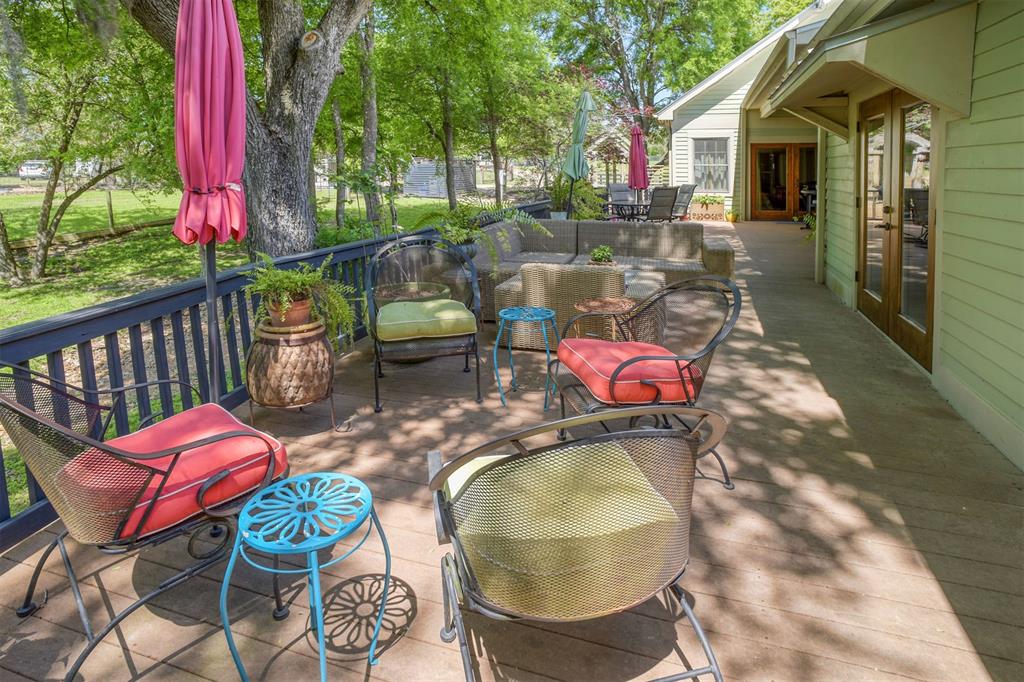 Walkway just off back deck over the season creek to the detached pool area.