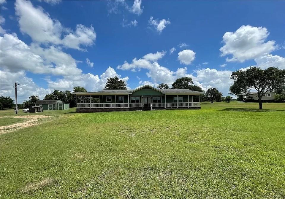 Circle driveway to the left of the property. Home sits nicely in about the middle of the property.