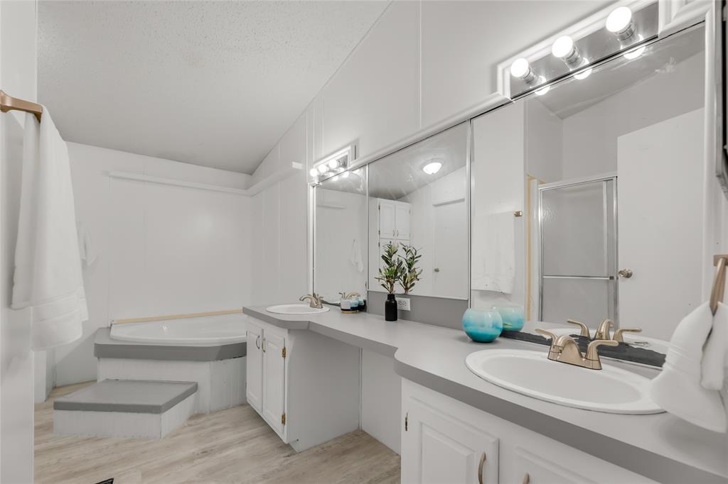 Primary bathroom with jetted tub, shower and double vanity