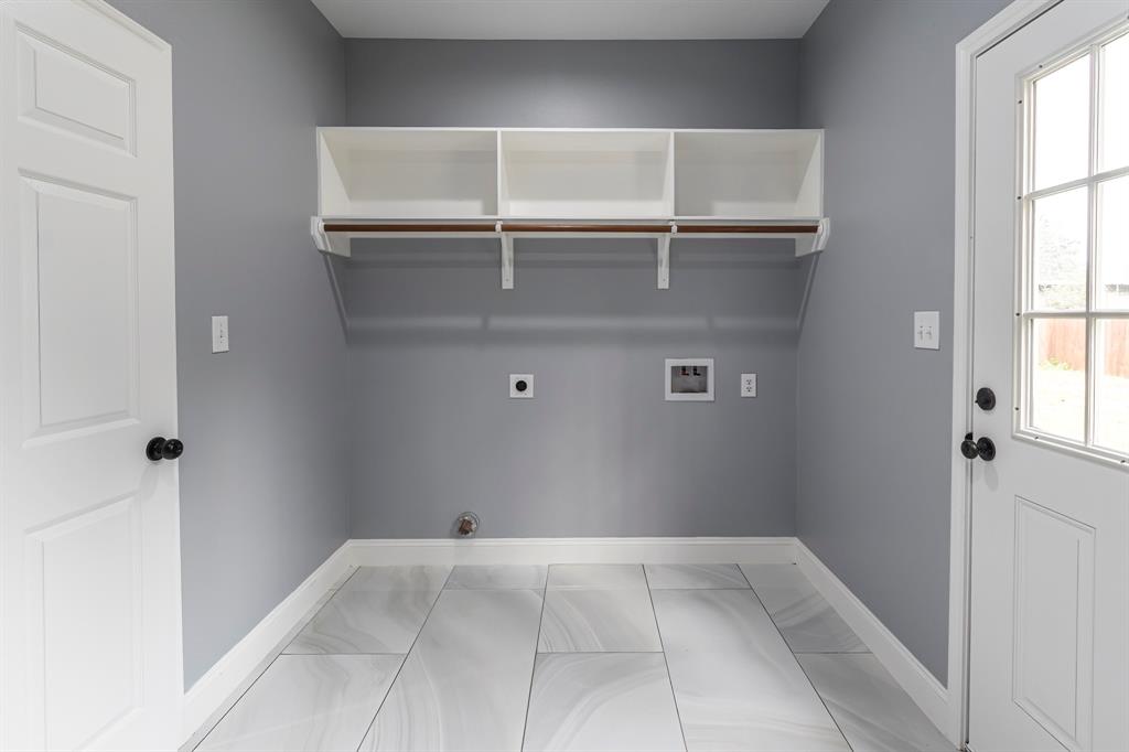 The laundry room off the kitchen with access to the back yard.