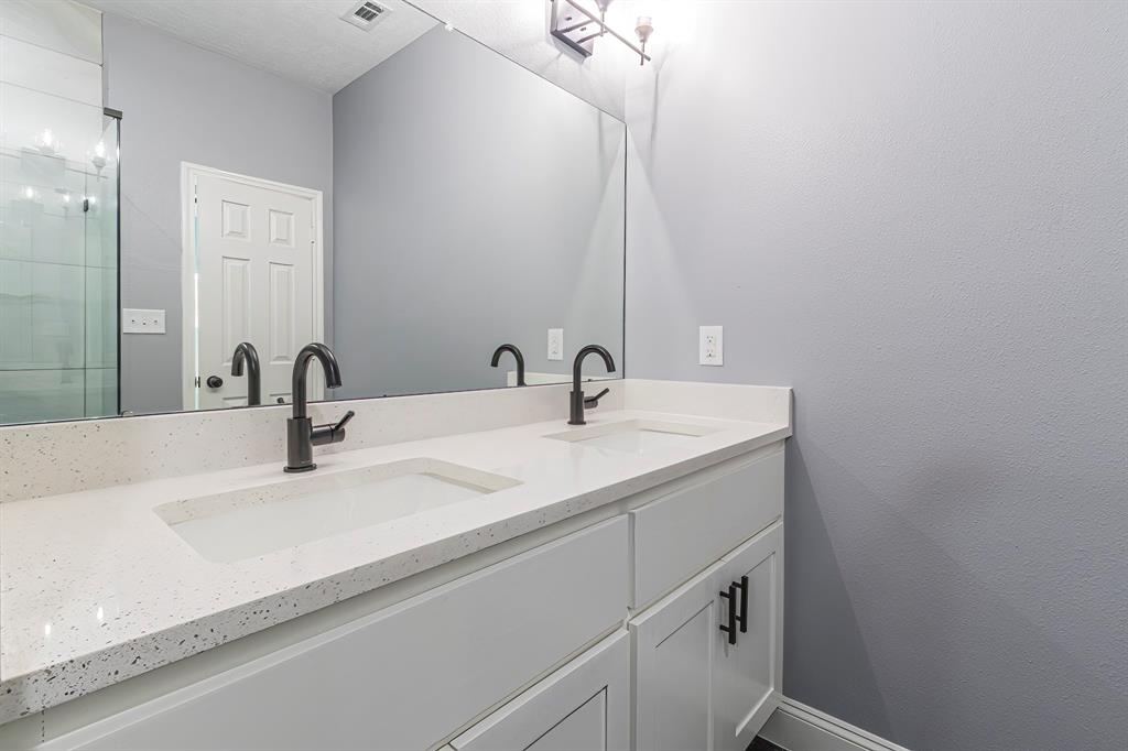 First primary bath with double sink areas.