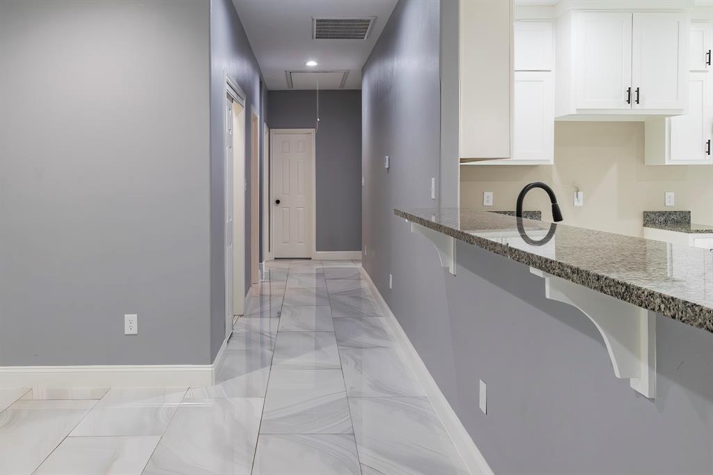 Looking down the hallway from the kitchen/living space