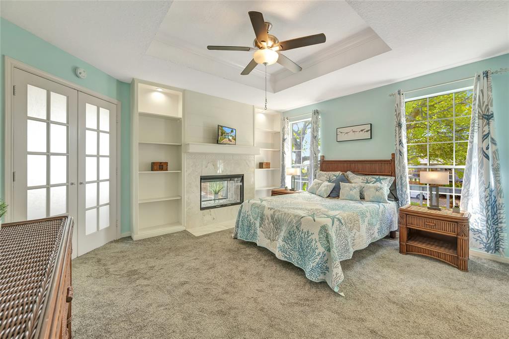 High ceilings in Primary bedroom and double side fireplace