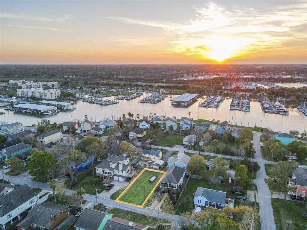 The potential for a second-floor balcony offers a vantage point that is nothing short of breathtaking. Imagine ending each day with panoramic sunset views that paint the sky in shades of orange, pink, and purple over the water, providing an ever-changing backdrop to your life. This outdoor living space will quickly become your private sanctuary, where moments of peace and gatherings with loved ones are equally cherished.