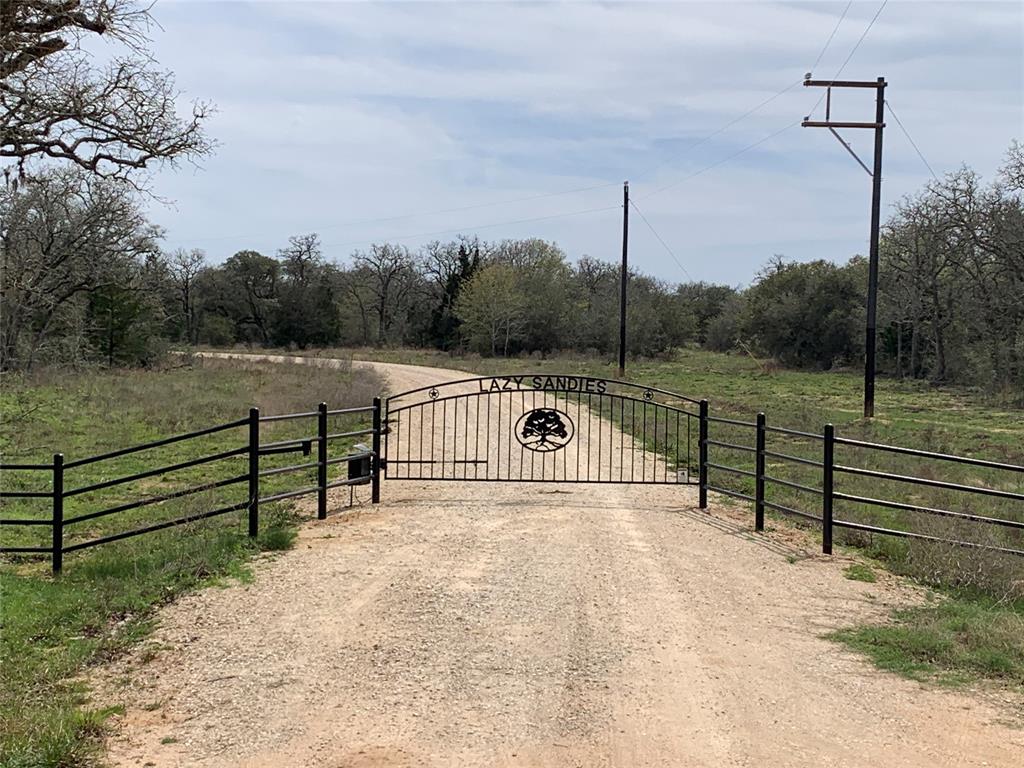Lot 5, 10.995 acre tract in The Lazy Sandies Subdivision located in Lavaca County approximately 18.5 miles southeast of Hallettsville at the end of County Road 158, and on Private Road 1581. Secluded wooded tract features live oaks and variety of trees, brush, loamy sand soil, wildlife, ATV trails and building sites. Frontage road is built and Electric lines are built. Electrical meter pole is on property along with a newly dug water well, and some clearing has been done on this lot. Ideal recreational property for weekender or full-time living. This lot will be a conveyance of the Surface Estate only & no mineral or royalty rights will be conveyed. See additional information to view Subdivision Plat and Restrictions. Tri-County Realty will co-broker with Buyer’s Agent making initial contact & present at all property showings. Contact Roger Sustr with Tri-County Realty for additional information or to schedule an appointment to view.