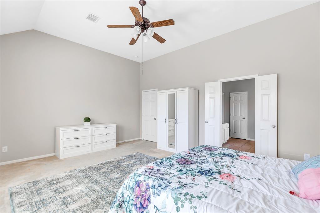 Primary bedroom, located downstairs, with an en-suite bathroom.