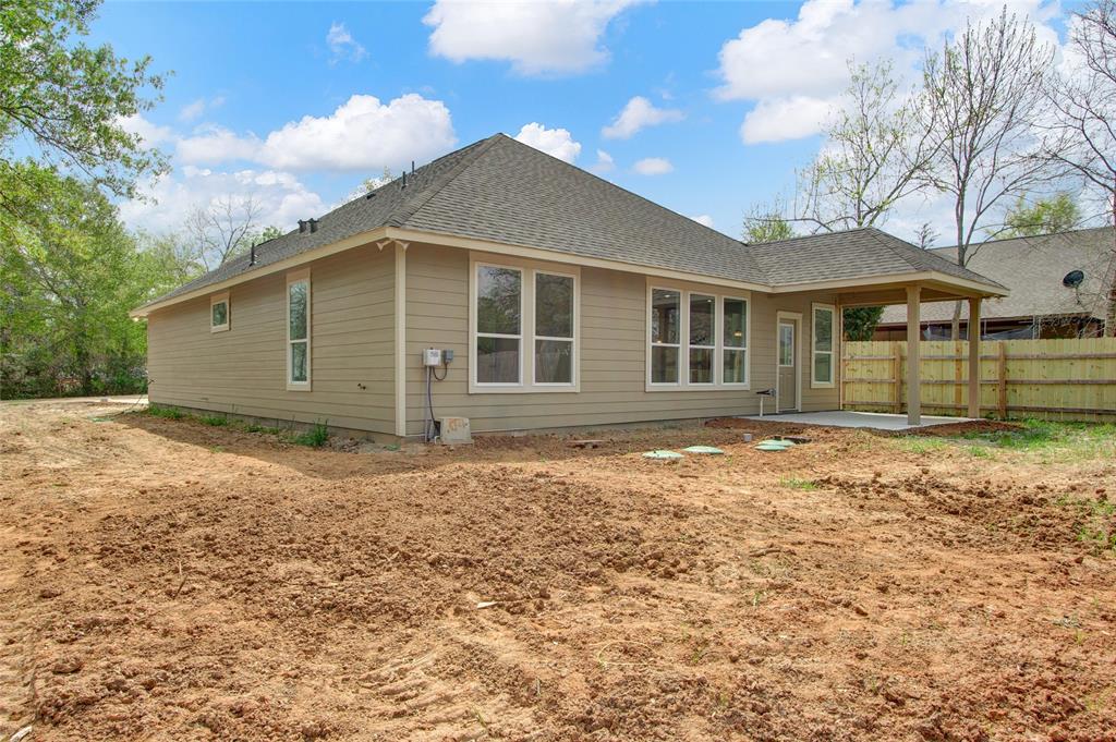 Back view of home with cover patio with your own outside sink