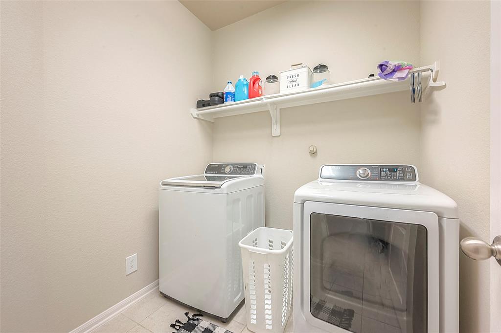 The utility room is conveniently located in the house offering easy access for completing daily chores.