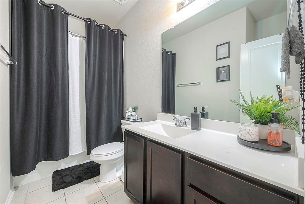 The secondary bathroom features a bath/shower combo. Ready for your daily needs.