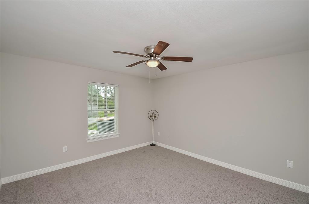 Another view of the primary bedroom.