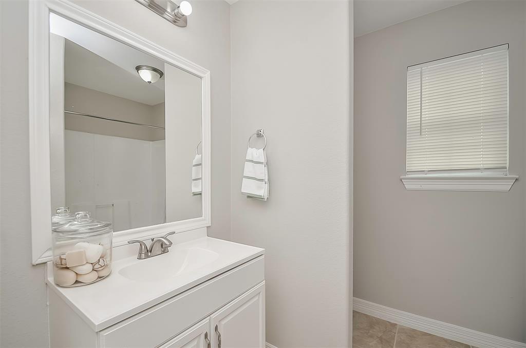 A clean, white bathtub with neutral walls.