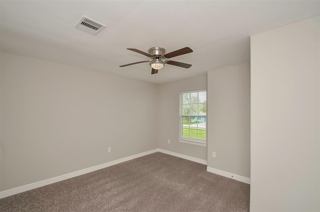 New carpet in this upstairs bedroom shows a virtually staged view.