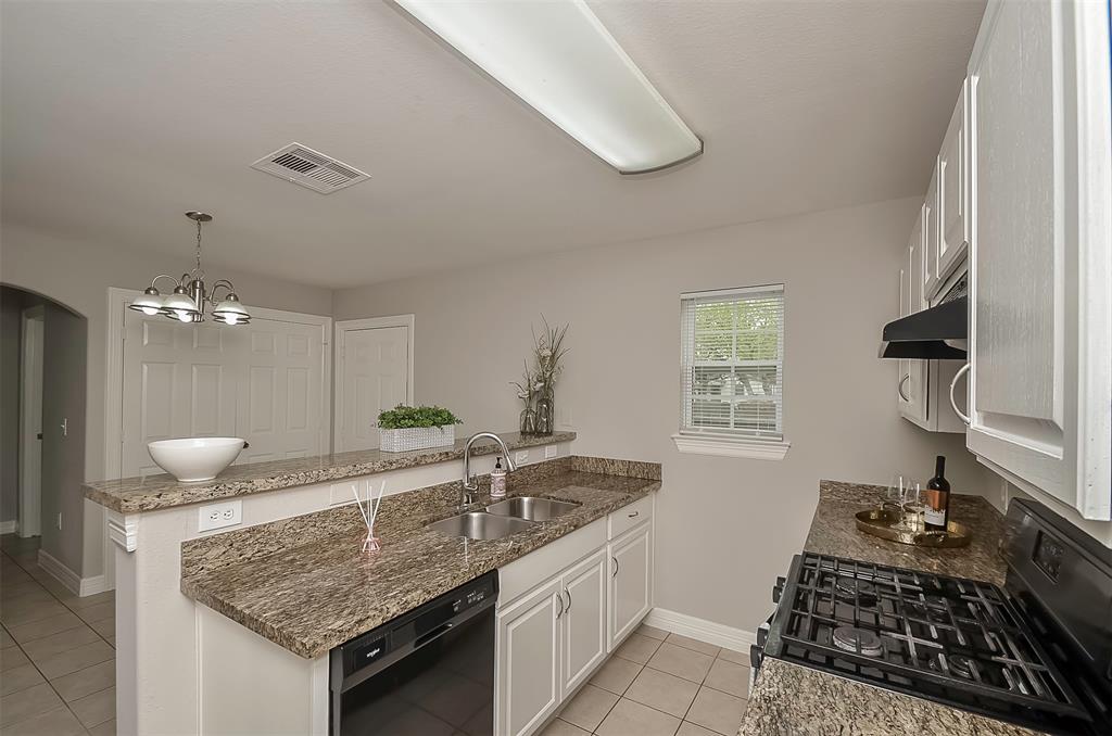 A view of the breakfast area and door leading to the backyard.