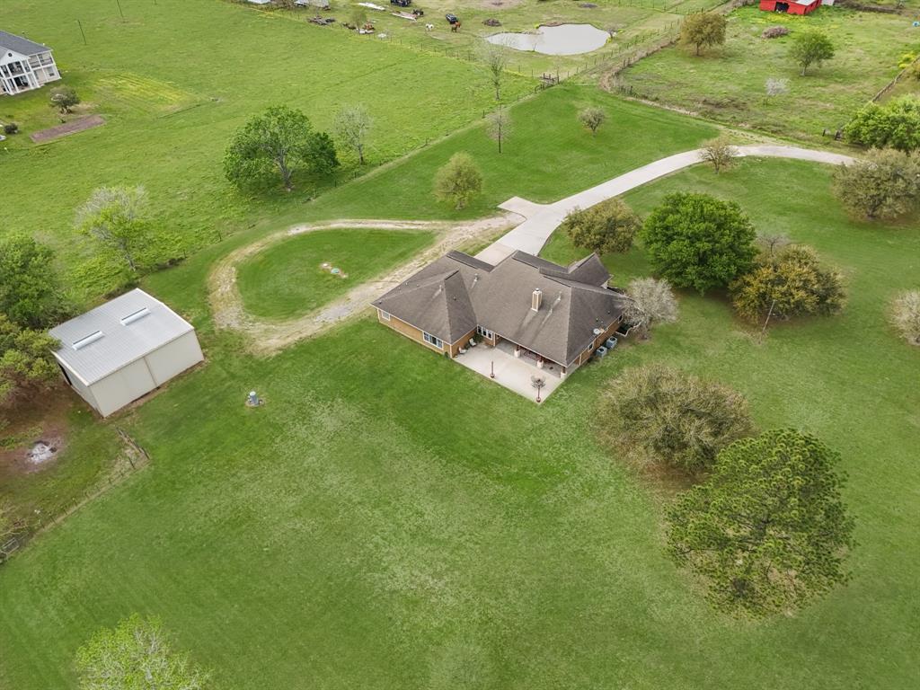 Lengthy Concrete driveway meets the private road