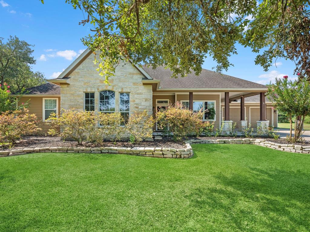 Classical open concept design w/ table top ceiling & beautiful stone fireplace