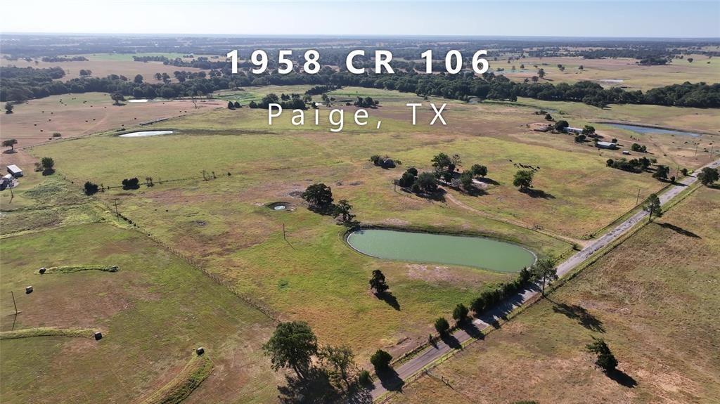 Are you ready for your Texas country fix? This 43 acres has it all! Public water and electricity on site, two healthy ponds, mature trees, and much more! Choose your spot for building and gardening while you take in breathtaking views. This land is not far from local restaurants and outings, including Paige Icehouse and Paige Roadhouse, where you can enjoy watching sports, listen to live music, have dinner, and play a game of pool. BONUS- ATX is less than 1 hour away! There is an Agriculture exemption currently in place keeping taxes very low, plus the land is fully fenced and ready to take on your next adventure. Make sure to watch the video tour of the magnificent property. You will not be disappointed! Seller is in the process of getting floodplain map adjusted with FEMA. Ask agent for more details!