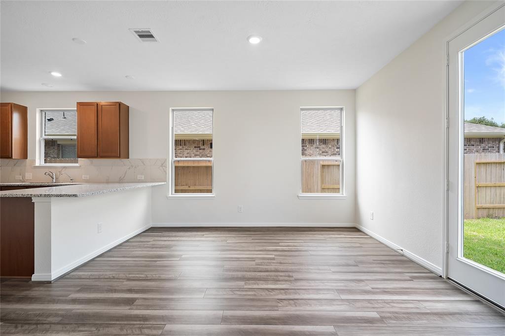 Start your day off right with a cup of coffee sitting with your family in the lovely breakfast area! Featuring large windows, custom paint, tile flooring, recessed lighting and large windows.