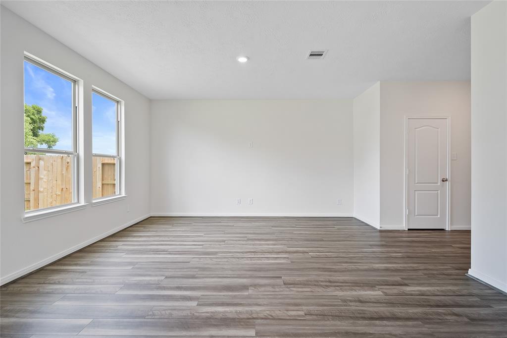 Gather the family and guests together in your lovely living room! Featuring high ceilings, recessed lighting, ceiling fan, custom paint, gorgeous tile floors and large windows that provide plenty of natural lighting throughout the day.