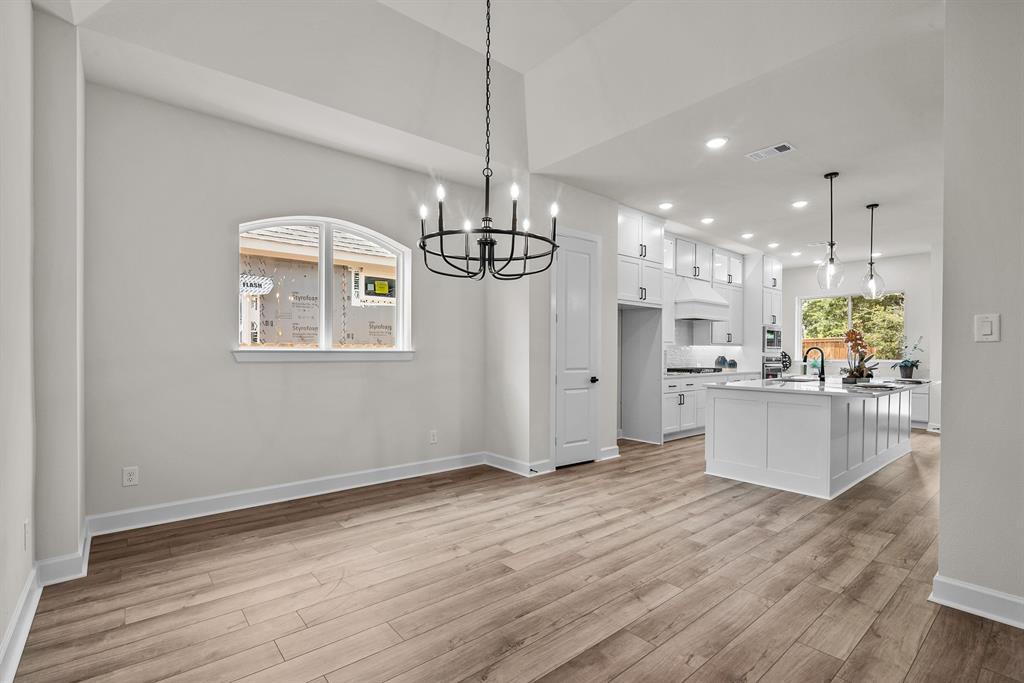 EXAMPLE PHOTO: Cabinets to ceiling, quartz counters, 36 in c-top w/updraft vent hood too!