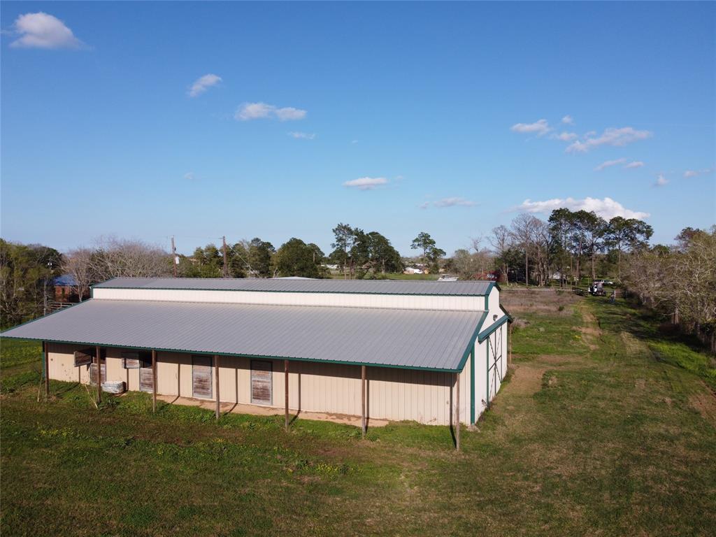2.3 Acres fronting on Ave J with metal barn on slab.  Excellent condition.  Barn has 7 of the best horse stalls you can buy.  All concrete floor except for stalls.
Could be finished out as barndo or just used as a barn / shop.
Mulberry Farms subdivision borders property on 2 sides.