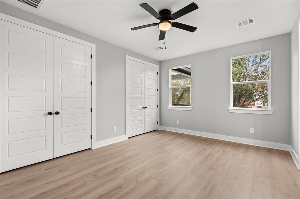 Primary bedroom with double closets.