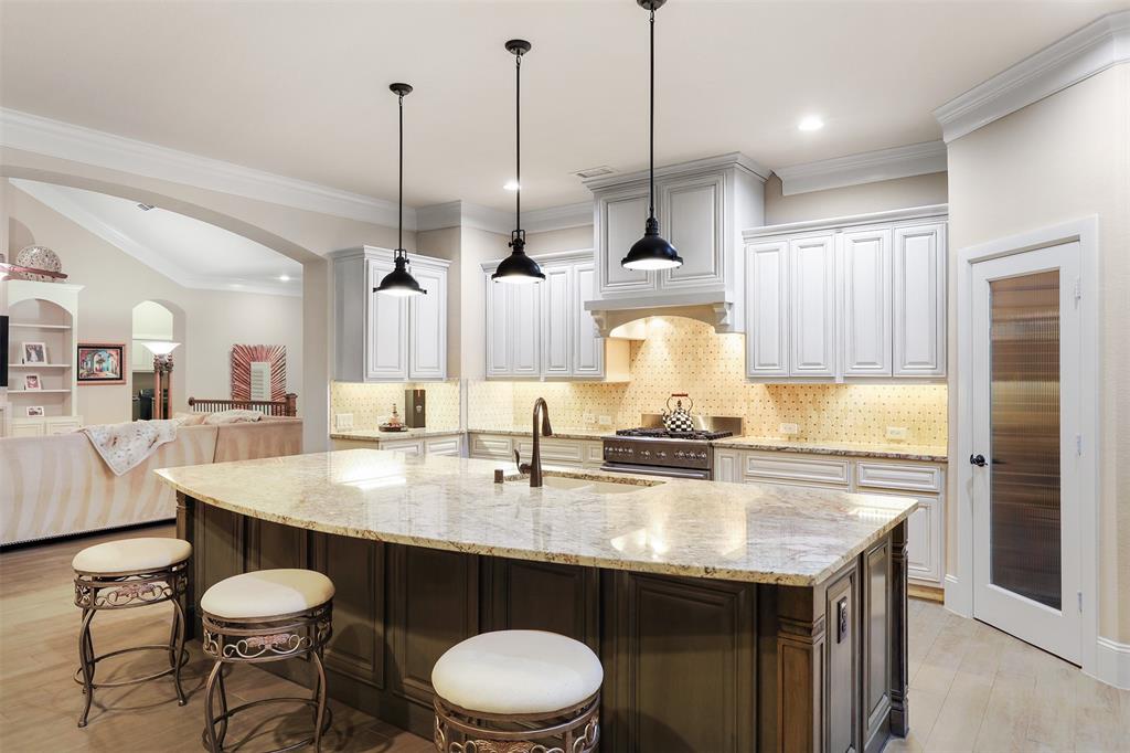 Generous amounts of seating around the kitchen island.